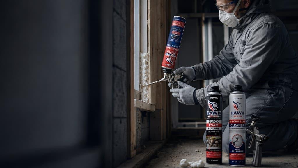 Applying Hawk Chem USA polyurethane spray foam around a building frame